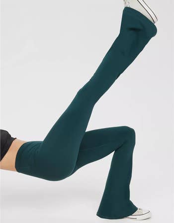 Model wearing the dark green leggings