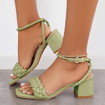 model wearing the green braided heels