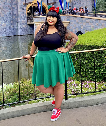 Reviewer wearing green skirt