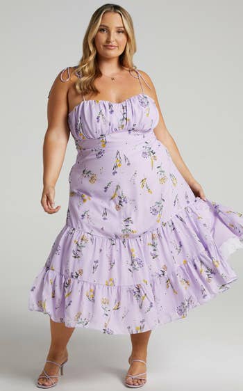 model wearing purple midi dress