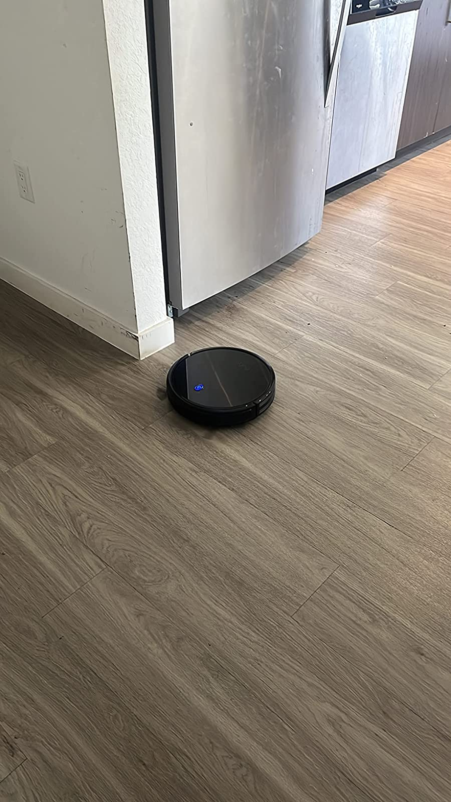Robot vacuum on reviewer's hardwood floor