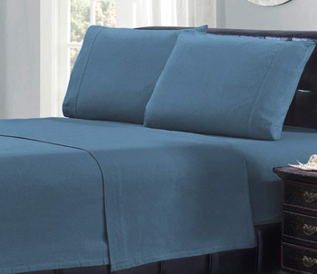 a bed with the sheet set in blue