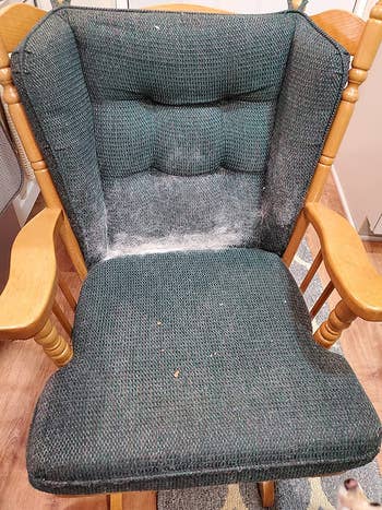 a reviewer photo of a rocking chair covered in pet hair 