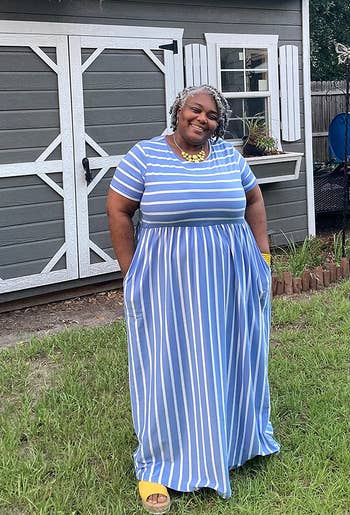 Reviewer wearing blue and white striped maxi dress