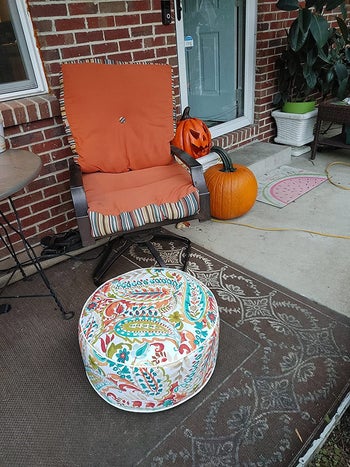 Reviewer photo of outdoor ottoman in warm paisley color