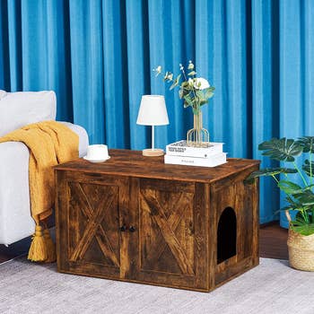 large side table in rustic style with hole cut out for cat to enter