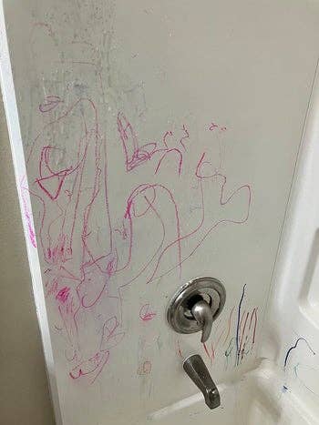 reviewer image of child's scribbles on bathtub wall