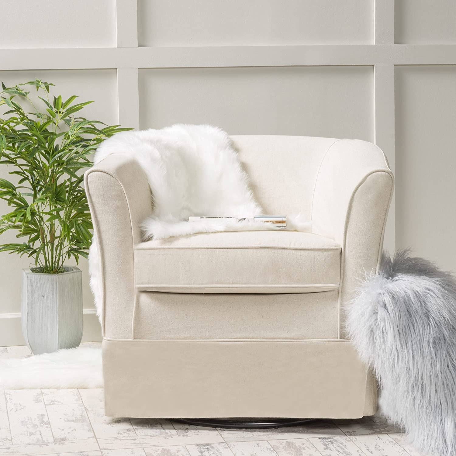 natural fabric chair with rounded back, arm rests, and swivel skirt
