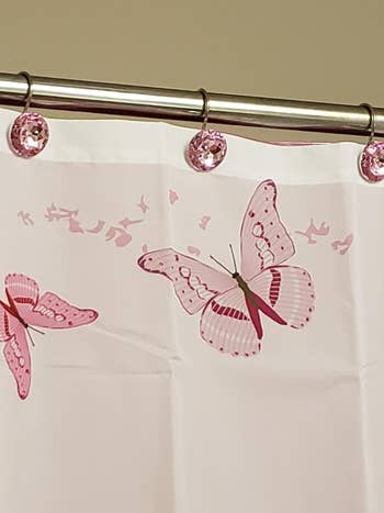 A reviewer's pink curtain holders