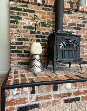 reviewer brick fireplace with padding on edges 