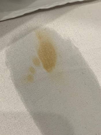 reviewer before showing a yellow stain on white fabric