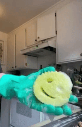 a gif of a person squeezing the sponge
