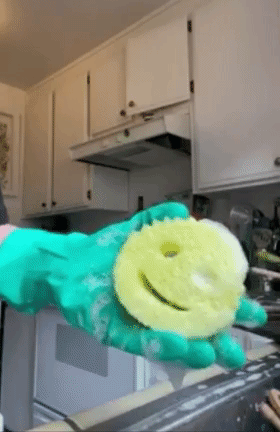 a gif of a person squeezing the sponge