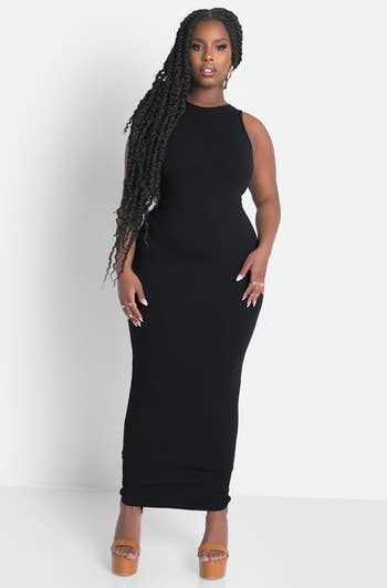 front view of a model in the black bodycon maxi dress