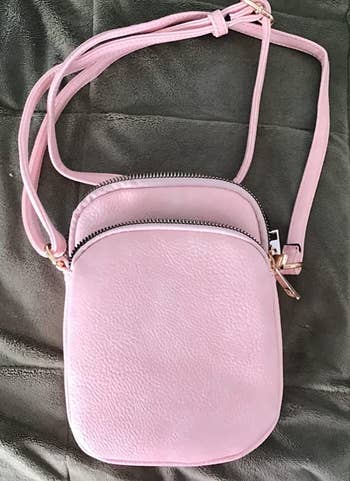 a reviewer photo of the purse in pink 