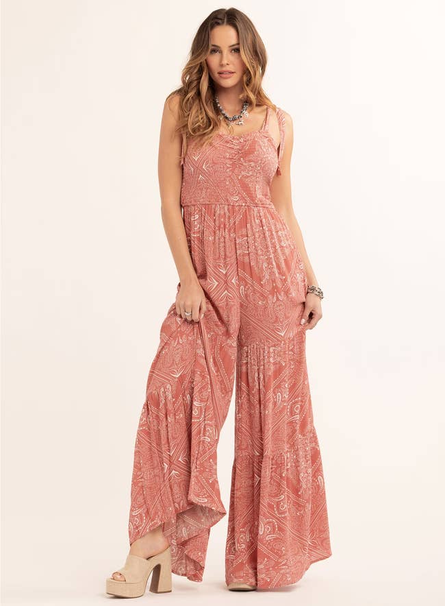A exemplary wearing the jumpsuit