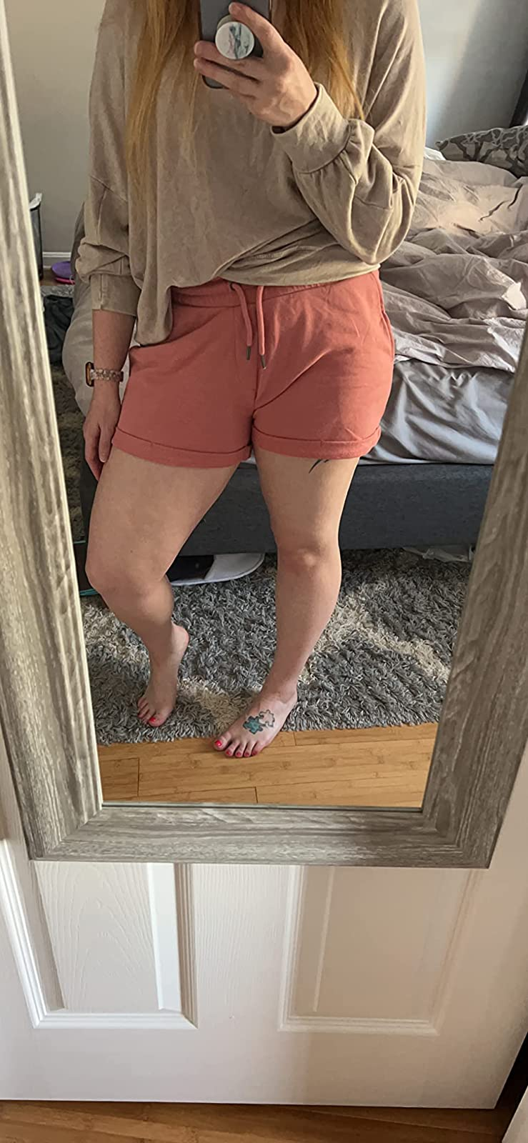 reviewer wearing the shorts in dusty pink