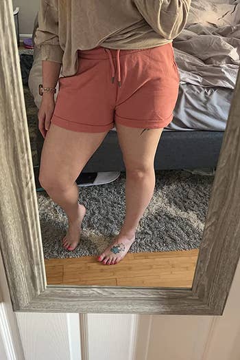 reviewer wearing the shorts in dusty pink