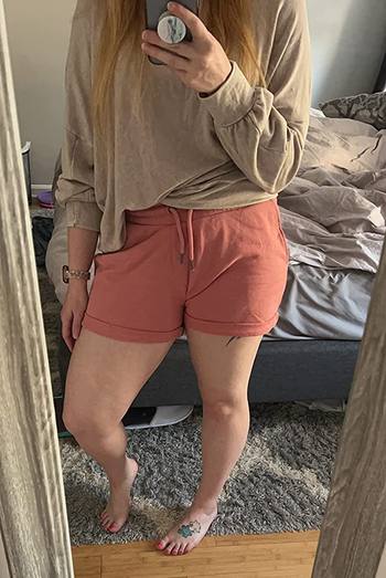 reviewer wearing the shorts in dusty pink