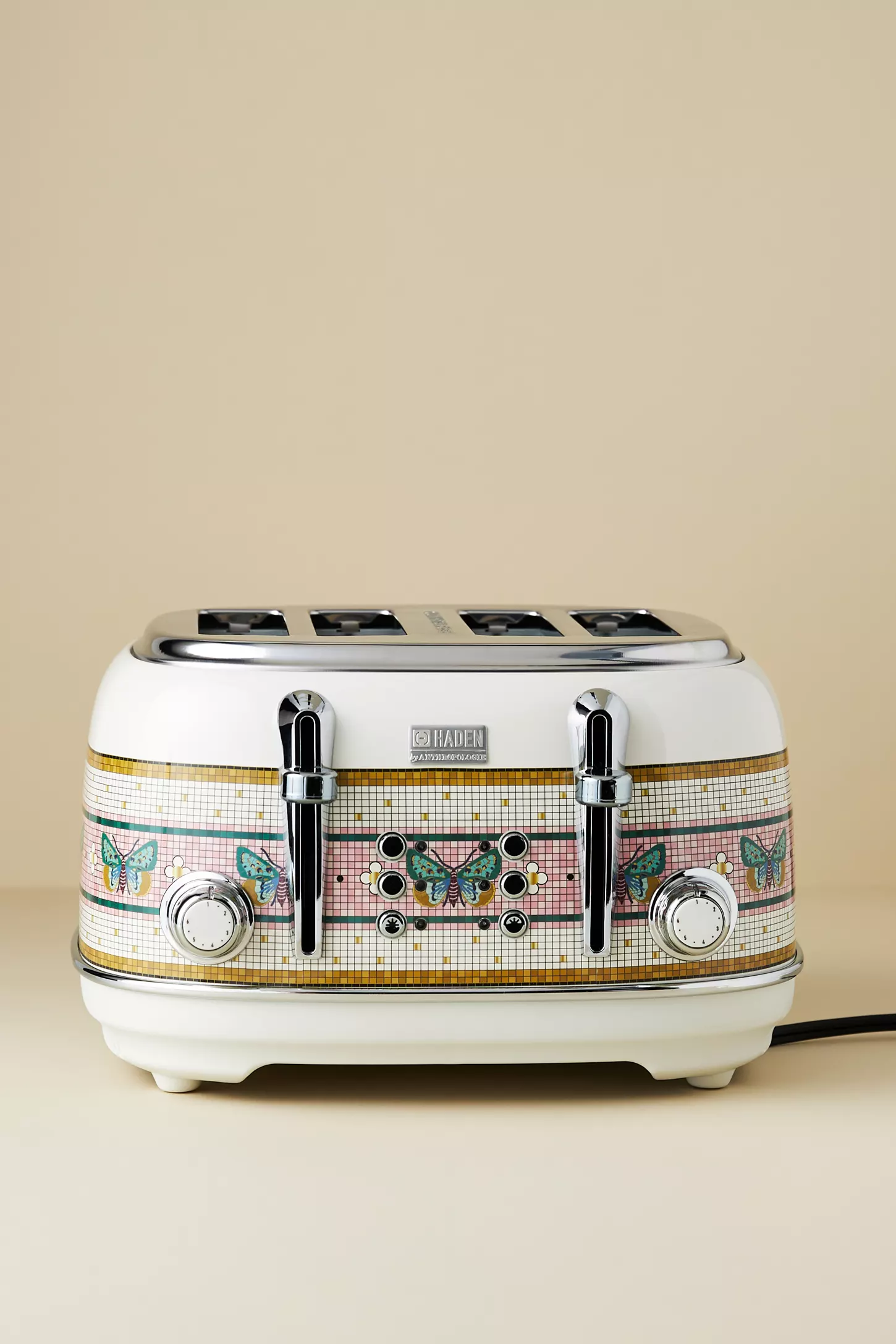 Vintage-style toaster with butterfly patterns, featuring 4  slots and chrome controls