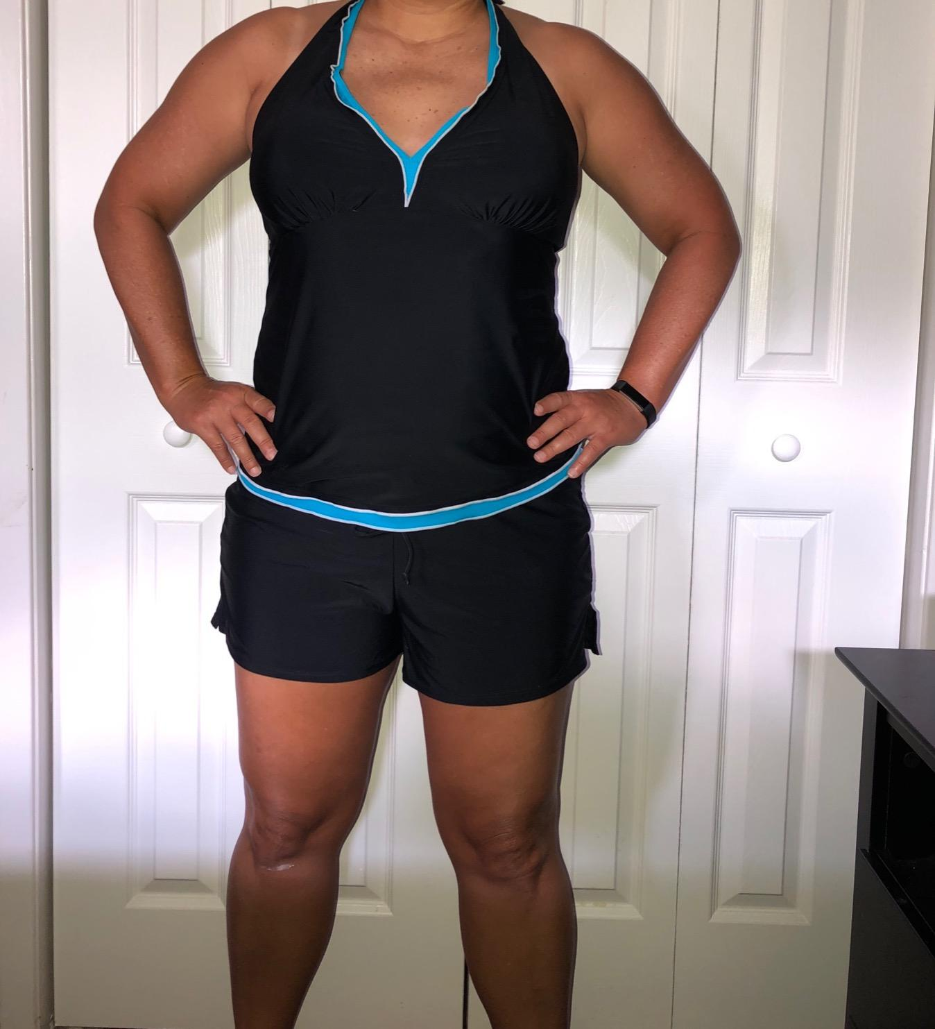 reviewer wearing the black boardshorts
