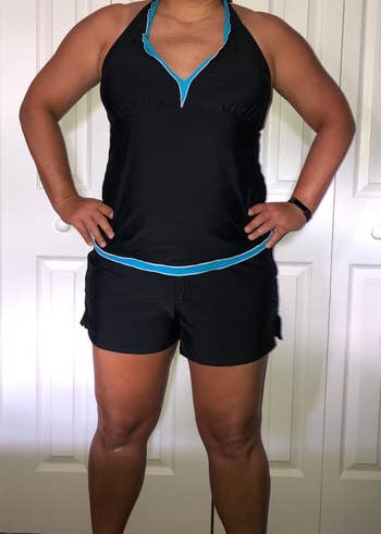 reviewer wearing the black boardshorts