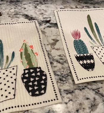 a reviewer photo of a swedish dishcloth with a cactus print 