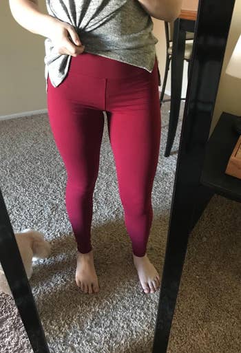 reviewer wearing the leggings in red