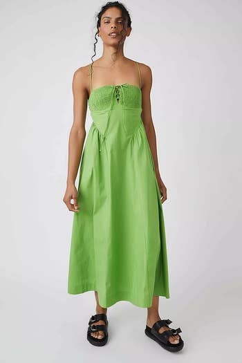 model in A-line green maxi dress