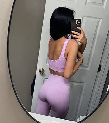 reviewer wearing the set in pink, showing the back view