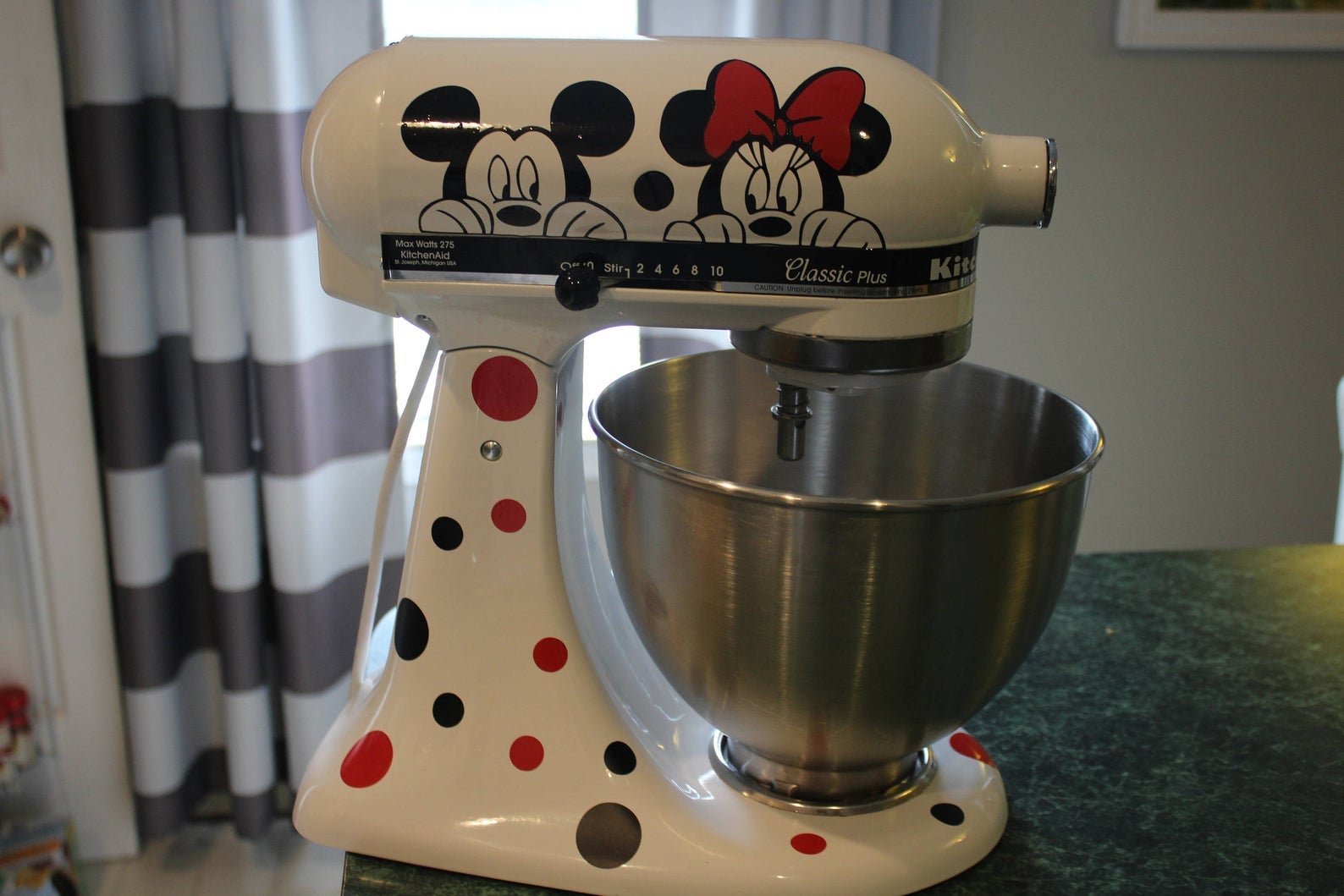 a white mixer with mickey and minnie decals