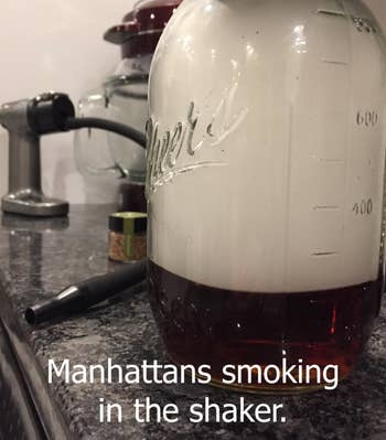 reviewer image of jar filled with smoke and product behind it with writing that says manhattans smoking in the shaker 