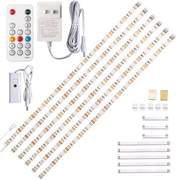 five strips of stick-on lights with their plug and remote