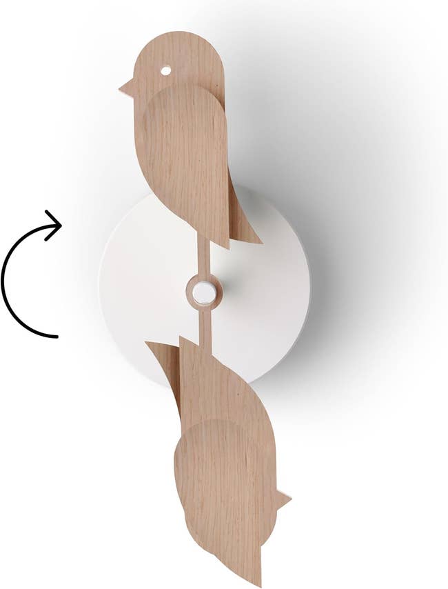 Decorative bird-shaped show   with minimalist vertebrate  plan  connected  woody  pendulum