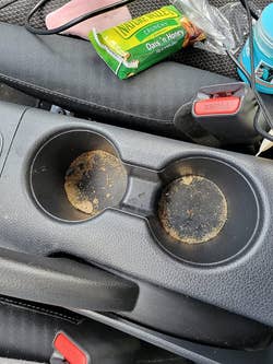 dirty cup holders in a reviewer's car