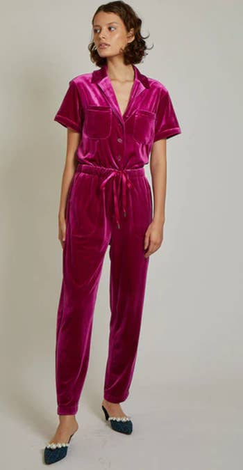 A model wearing the jumpsuit in pink