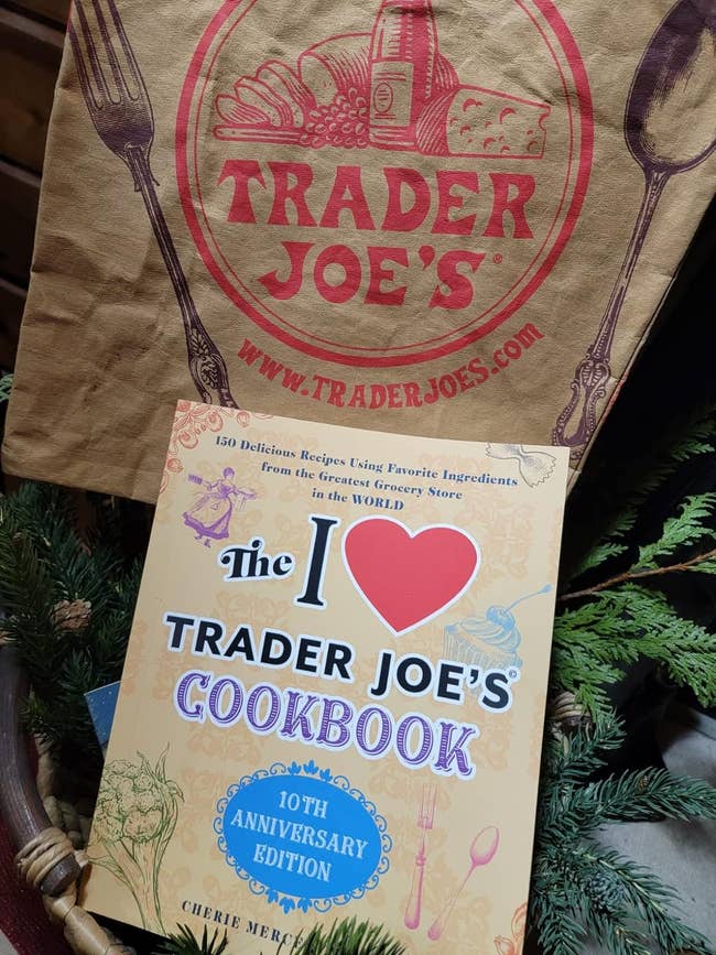 reviewer's cookbook in front of a Trader Joe's bag