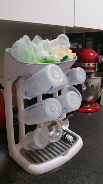 sideways reviewer image of bottles and lids drying on the drying rack