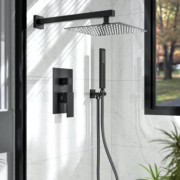 Modern rainfall  ablution  with wall-mounted handheld attachment successful  a sleek, minimalist bath  setting
