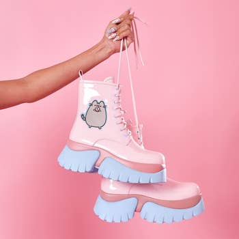 pink and blue lug sole lace up boots with pusheen eating a donut on the side
