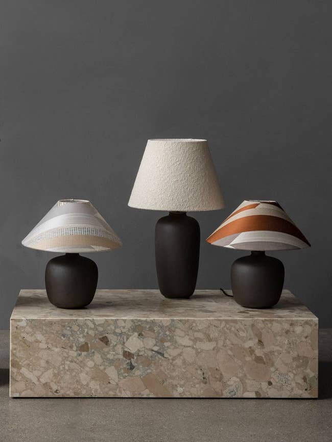 Three lamps in two different sizes with three different lampshades