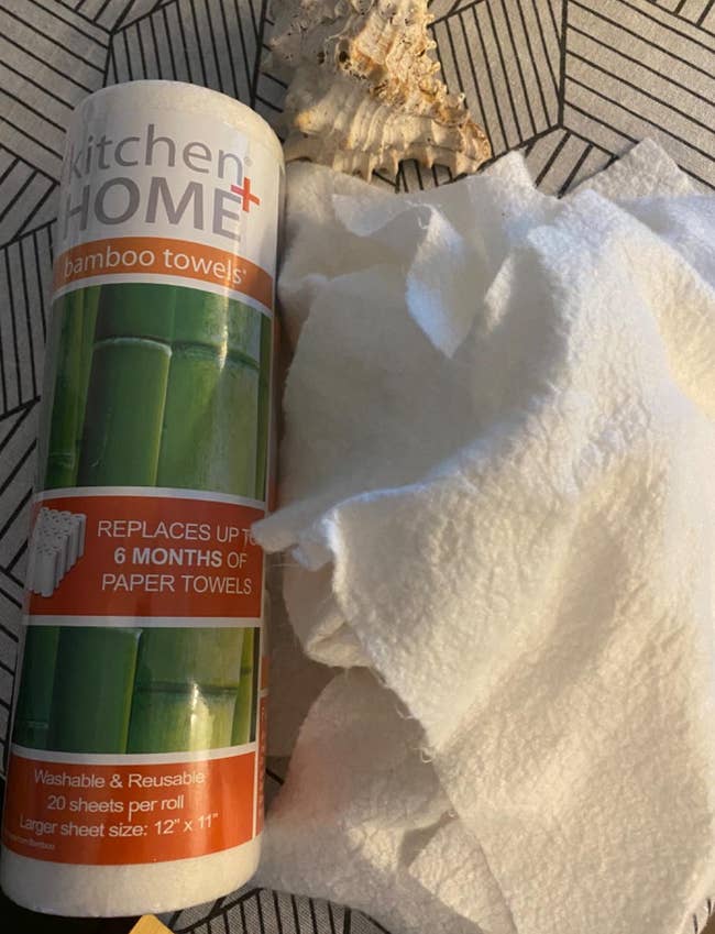 a reviewer photo of the bamboo towel roll and a few used and washed rags 