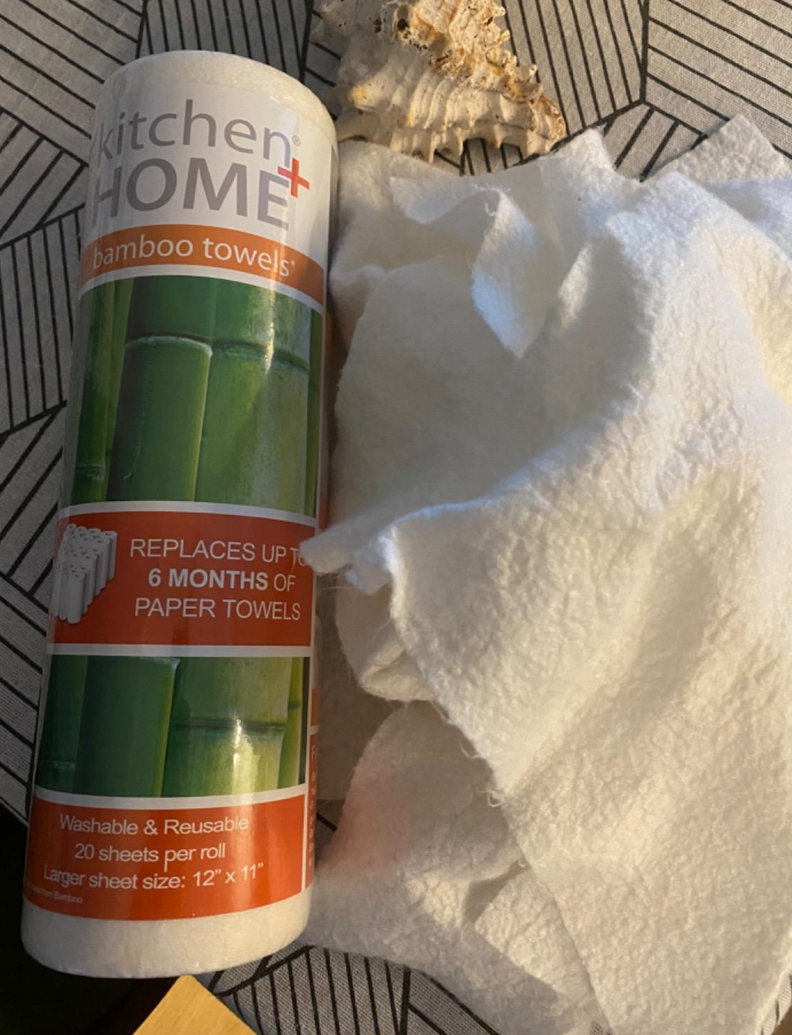 a reviewer photo of the bamboo towel roll and a few used and washed rags 