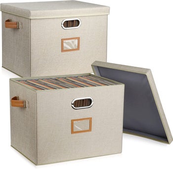 the two taupe boxes with tan handles, filled with records