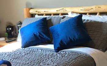 blue pillows on a bed