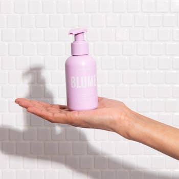 a pink bottle of blume cleanser