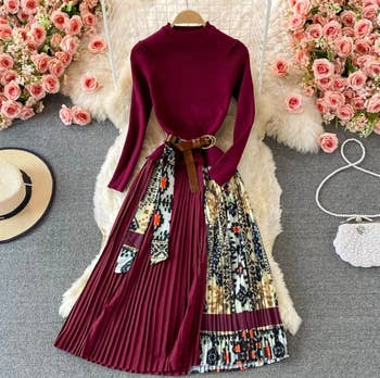 the burgundy dress styled with a brown waist belt