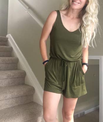 reviewer wearing one piece in green