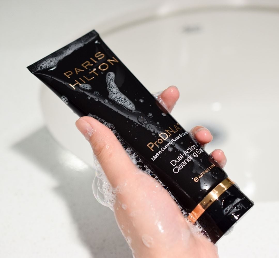 a hand holding the cleanser
