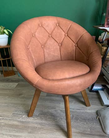 Reviewer image of faux leather cognac chair